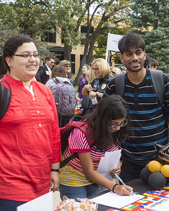 Students gather at a booth at a PNW Welcome Week rally