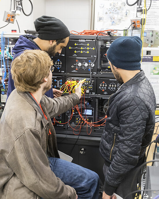 Three students working wiring