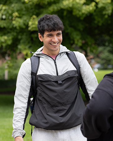 A student stands outdoors