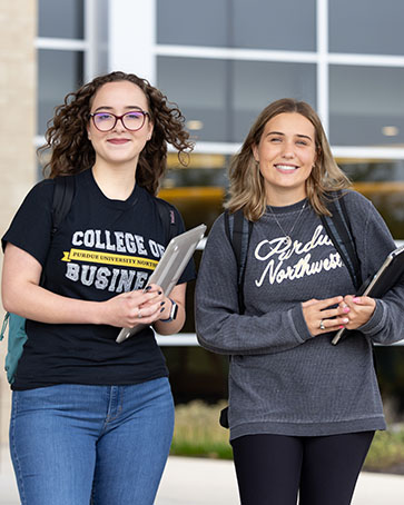Two students pose together.
