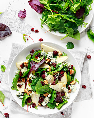 Fresh Pears, Blue Cheese salad with vegetable green mix, walnuts, cranberry. healthy food