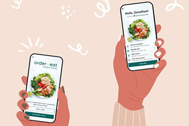 An Illustration of hands holding phones displaying the Order + Eat app.