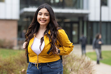 A PNW student poses outdoors