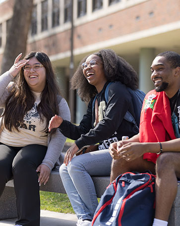 PNW students sit outdoors