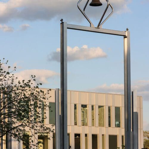 The PNW Bell Tower with the Student Union Library Building in the background