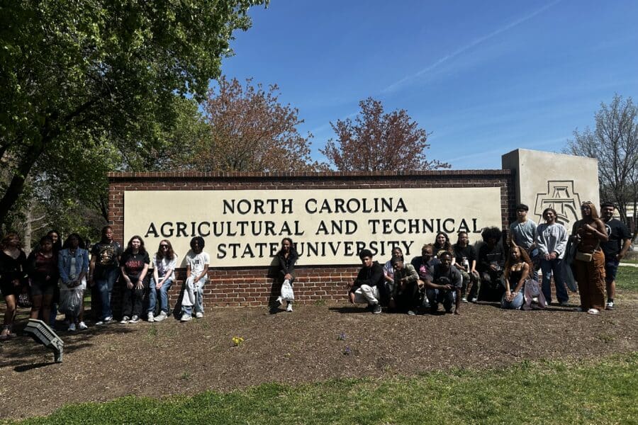 A group of students in front of a sign that reads "North Carolina Agricultural and Technical State University"