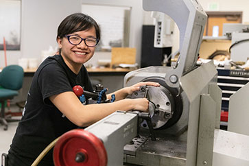 A student works with machinery.
