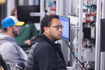 PNW student working on the computer in a classroom 363x242