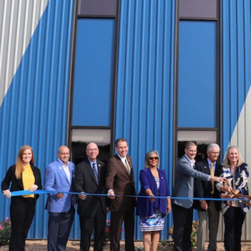 PNW Chancellor Thomas Keon among the guests celebrating the ribbon cutting of a 100,000 square foot building expansion by Morrison Container Handling Solutions