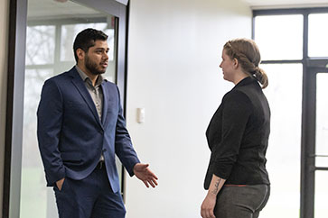 PNW students consult in a hallway