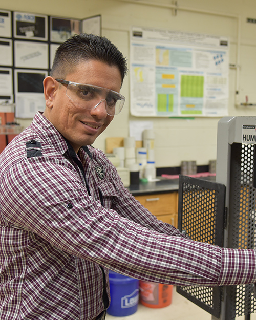hugo cedeno working on mechanical engineering project in lab