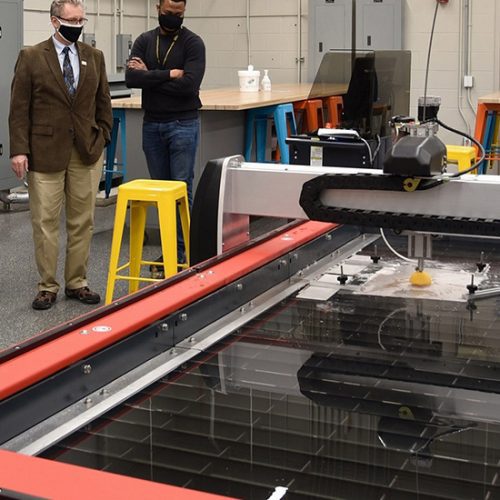 Stewart McMillan, chairman emeritus of Task Force Tips, tours the new PNW Design Studio with Dietmar Rempfer, director of the PNW School of Engineering and Marcel Mejulu, Design Studio support technician.