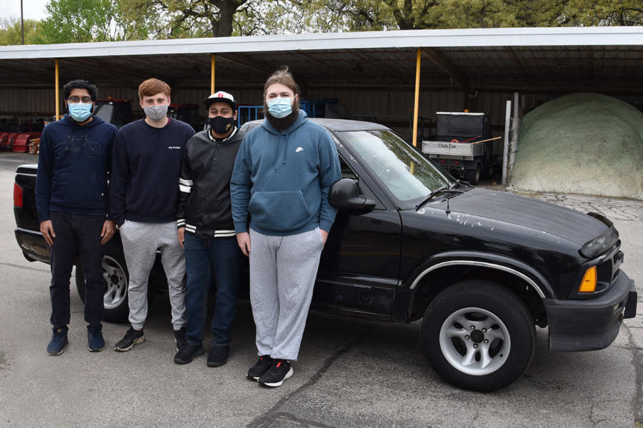 Senior Design spring '21 team of Ridwan Rahman, Jeffrey Osmulski, Mark Frost, Moises Picazzo with EV truck