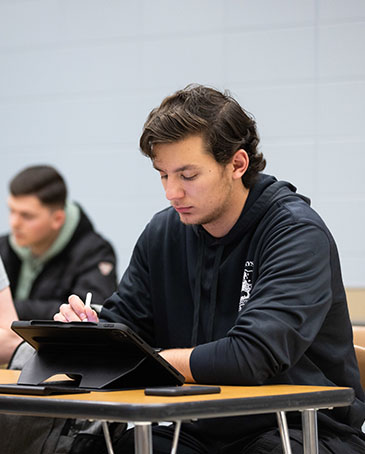 Student works on a laptop