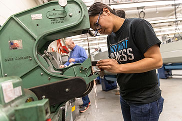 An engineer works with machinery.