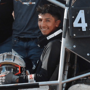 Azrael Jimenez sits in a baja car