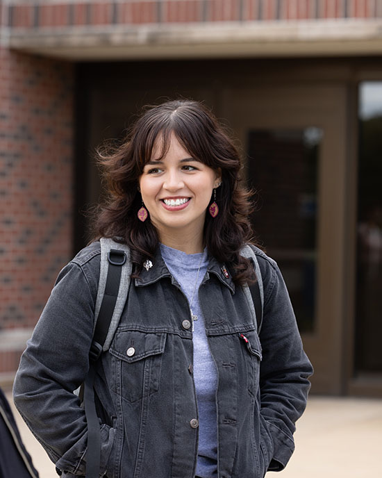 A PNW student in a black denim jacket.