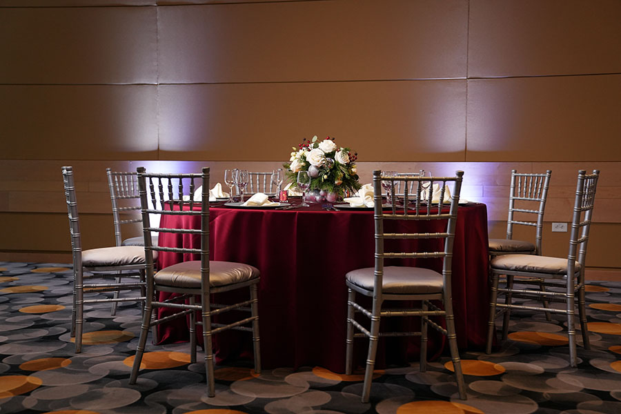 A table set with a floral centerpiece at the Great Hall Conference and Events Center