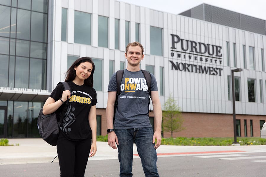 Two students stand outside of the Nils K Nelson Bioscience Innovation Building