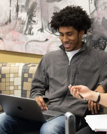 A PNW student works on a computer