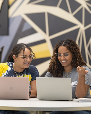 PNW students collaborate over laptops