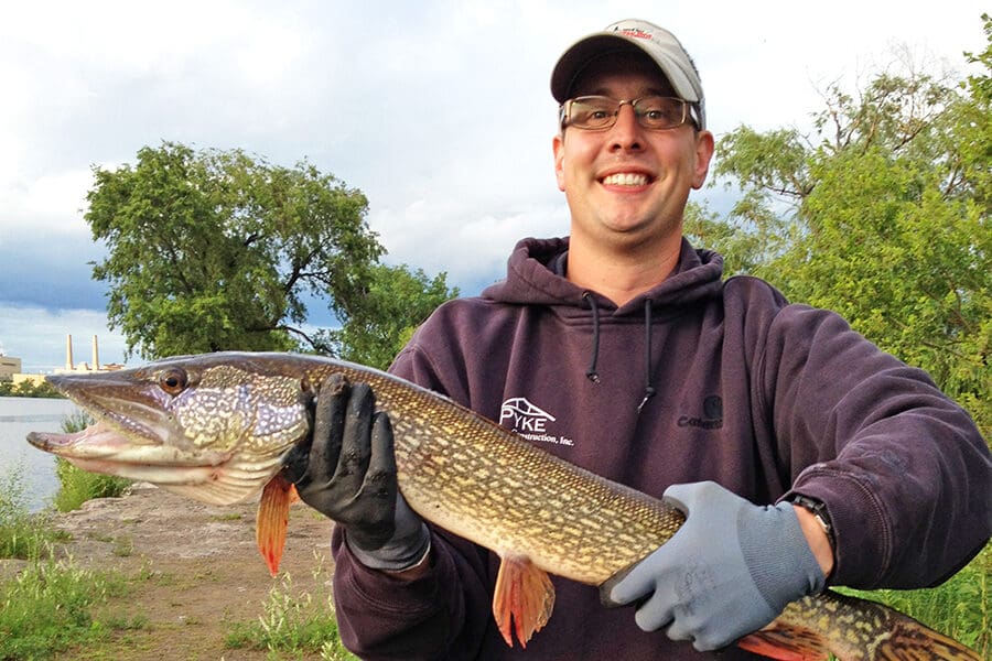 Student posing with fish