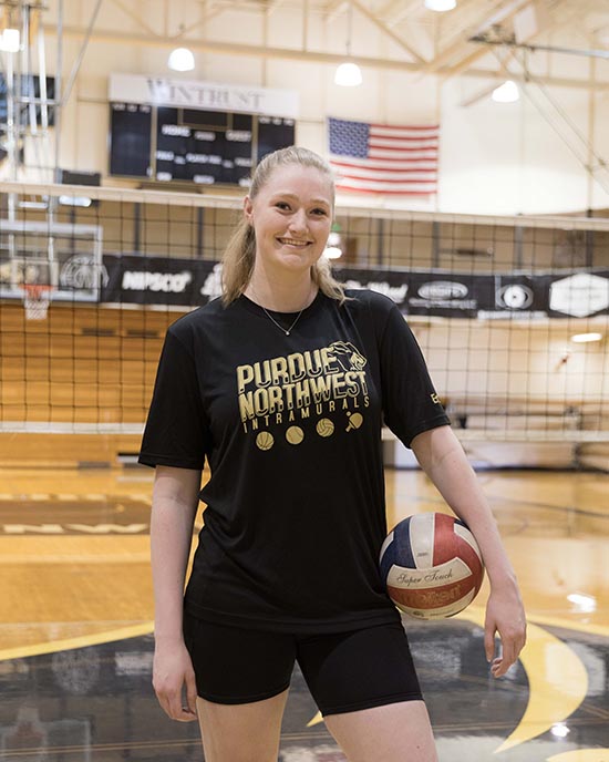 PNW student participating in the intramural while holding a volleyball