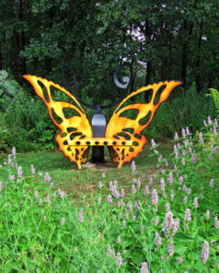 A butterfly sculpture in the native plant garden at Gabis Arboretum