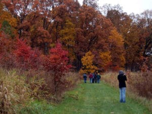 People walking on a trail in the fall