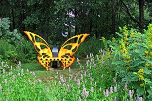 Butterfly sculpture in native plant garden