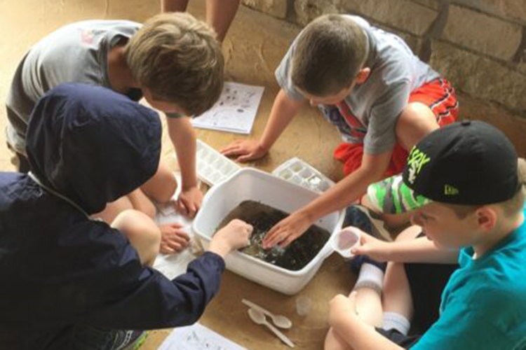 kids inspecting soil