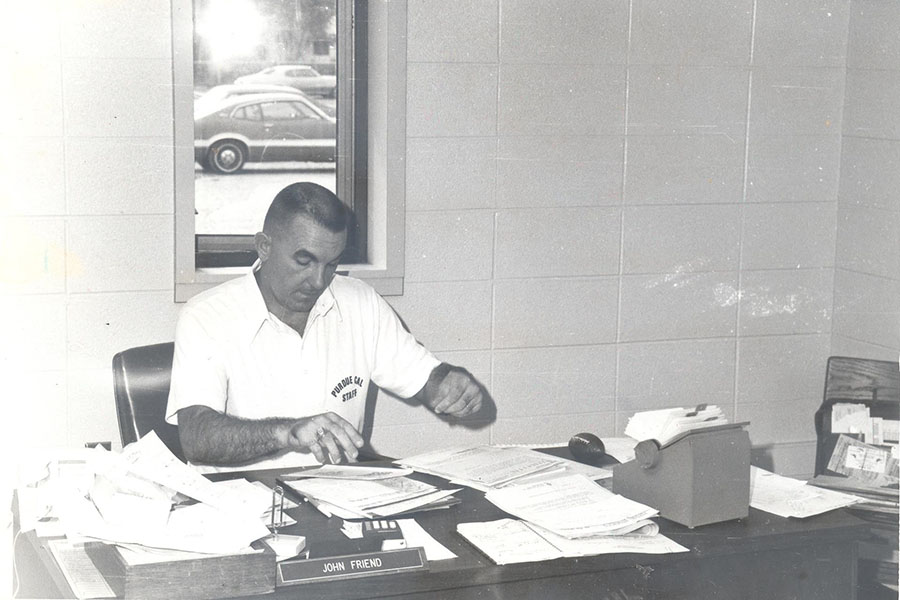 PNW Coach John Friend at his desk in 1980