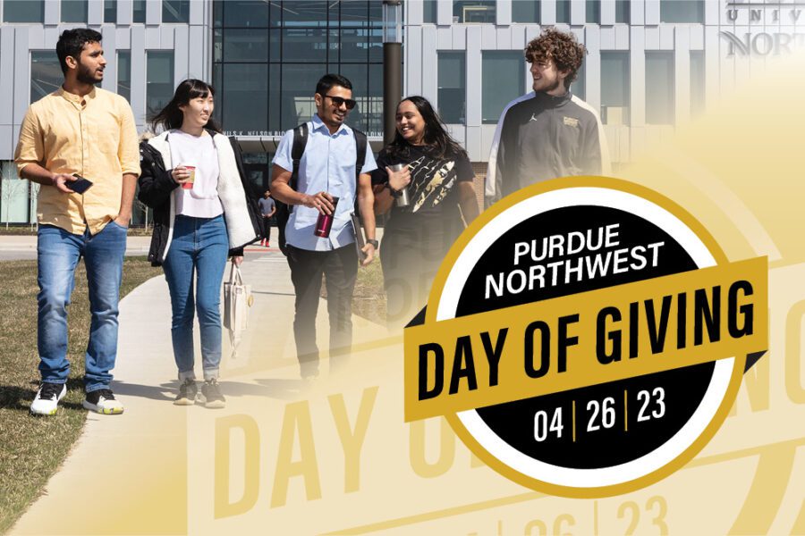 A group of students walks across campus. The PNW Day of Giving logo is in the bottom right corner.