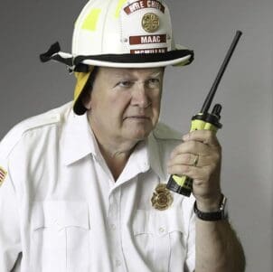 Stewart McMillan in firefighter gear.