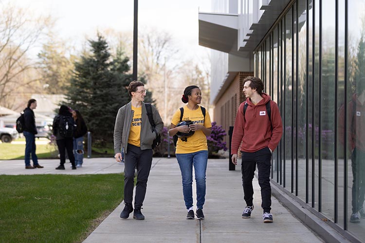PNW students walk together across campus