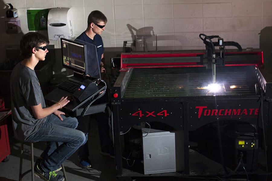 Students prepare pats using a plasma CNC torch