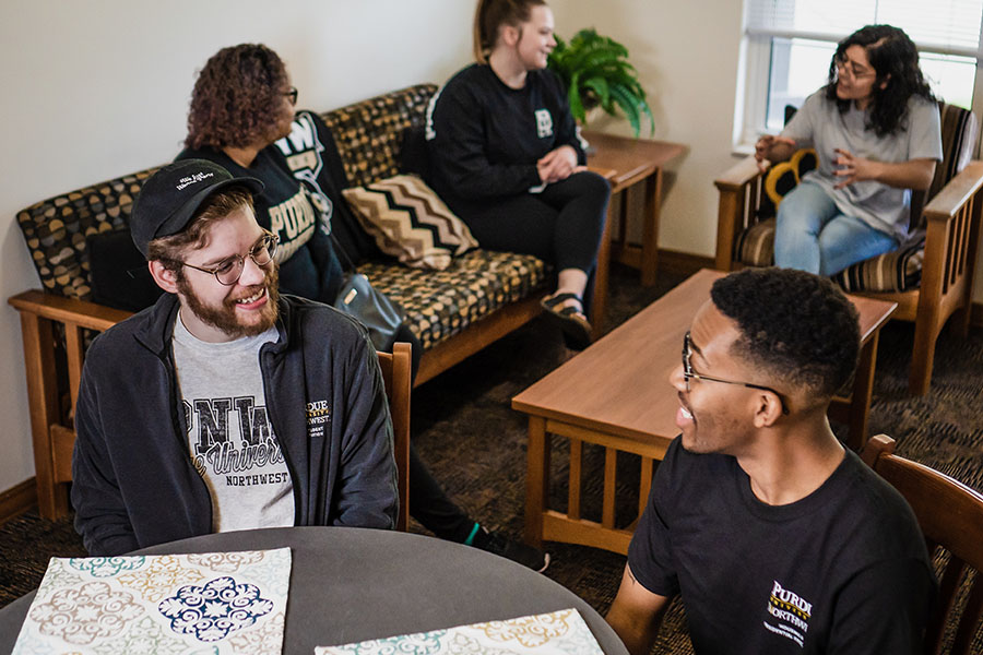 Students sit in a dorm living area