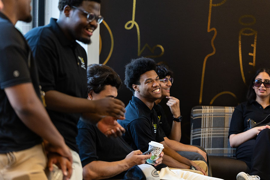 Students sit in the Calumet Hall lobby.