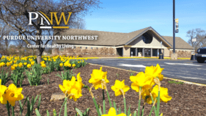 Building exterior with spring flowers of Center for Healthy Living at Purdue University Northwest