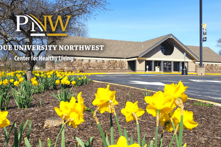 Building exterior with spring flowers of Center for Healthy Living at Purdue University Northwest