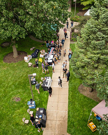 A group of people walk outdoors