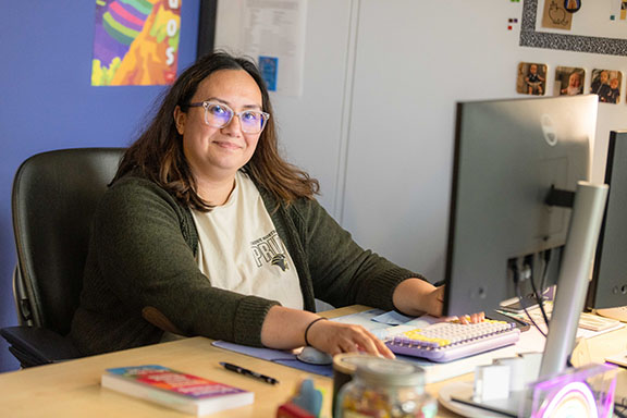 An employee works at a computer