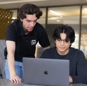 PNW students collaborate on a laptop