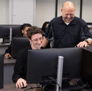 An instructor leads a computer-lab demonstration.