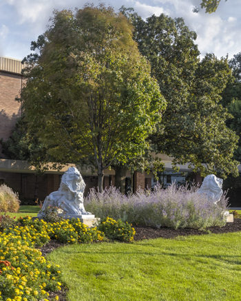 Lion sculptures outdoors on PNW's Hammond campus.