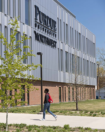 A student walks into the Nils K. Nelson Bioscience Innovation Building