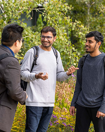 Three students stand outside on the Hammond Campus