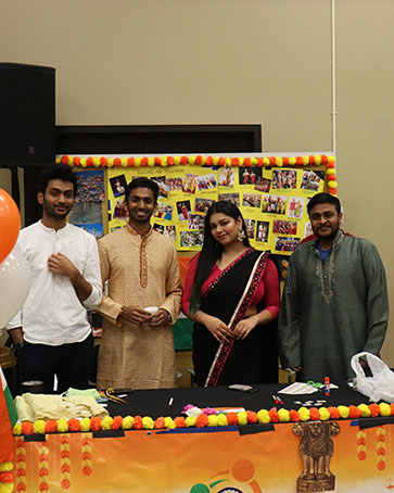 Four students with the Indian Student Association pose together during Global Groove
