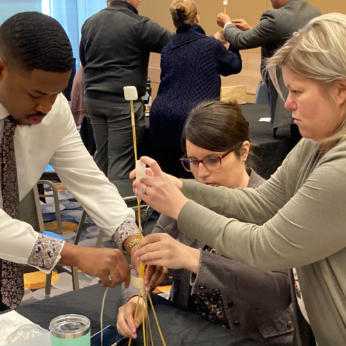 Leadership Northwest Indiana participants engage in a hands-on teamwork exercise during a recent session.