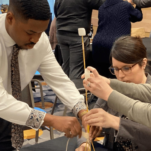 Three people working together on a project.